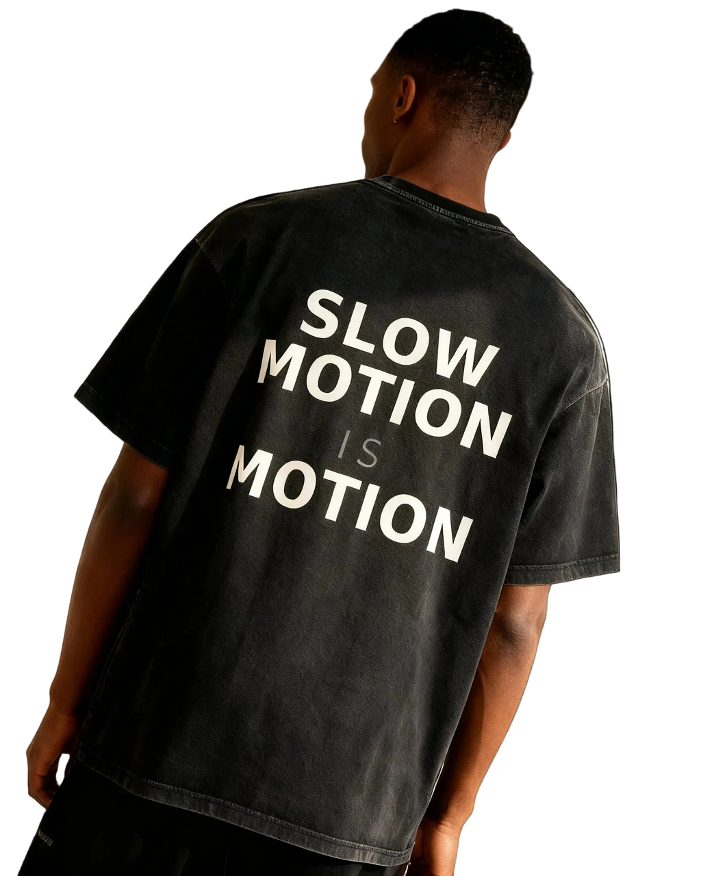 Person wearing a black t-shirt with 'SLOW MOTION IS MOTION' text on the back.